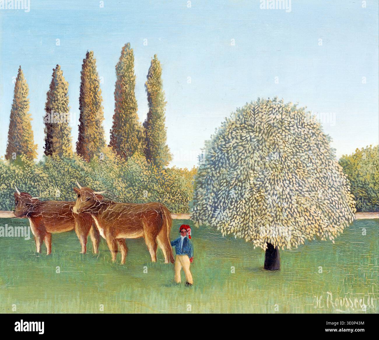 Cette peinture à l'huile de style naïf, 'Meadowland', par Henri Rousseau (le douanier) du début du XXe siècle, représente une scène pastorale avec deux vaches qui paissent dans un champ vert vibrant. Une figure solitaire dans un chapeau rouge et une veste bleue se tient près d'un grand arbre complet, sur fond de grands cyprès et d'un ciel bleu clair, mettant en valeur la perspective plate caractéristique de Rousseau et la qualité onirique. Banque D'Images