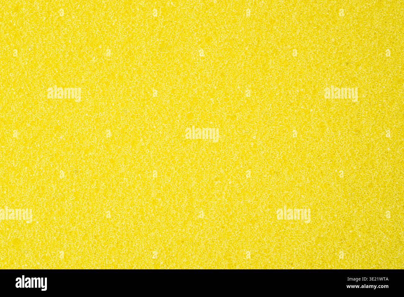 Texture éponge jaune vif avec fond de nettoyage abstrait poreux Banque D'Images