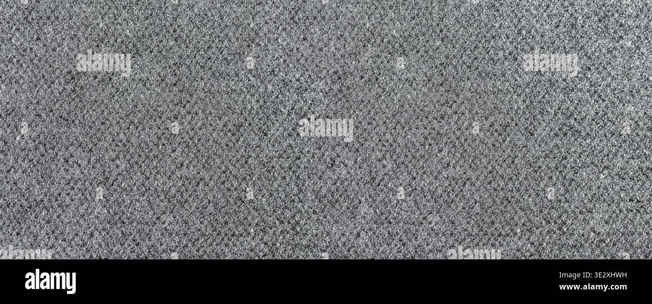 Gros plan de la texture de tissu feutre gris fournissant un fond de matériau tactile Banque D'Images