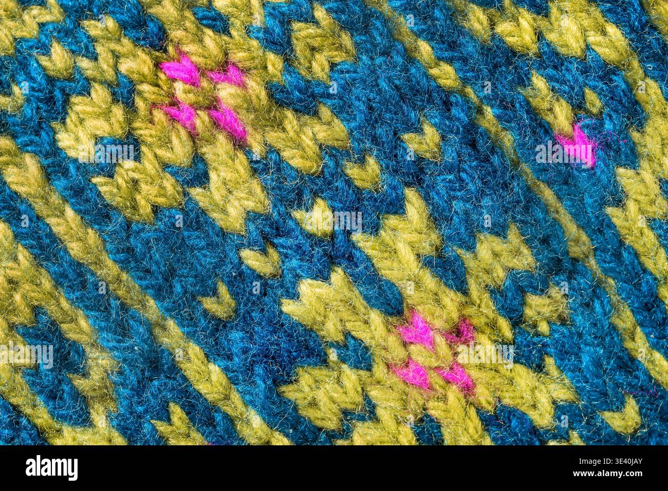 Fond tricoté en laine de motif bleu et jaune gros plan Banque D'Images