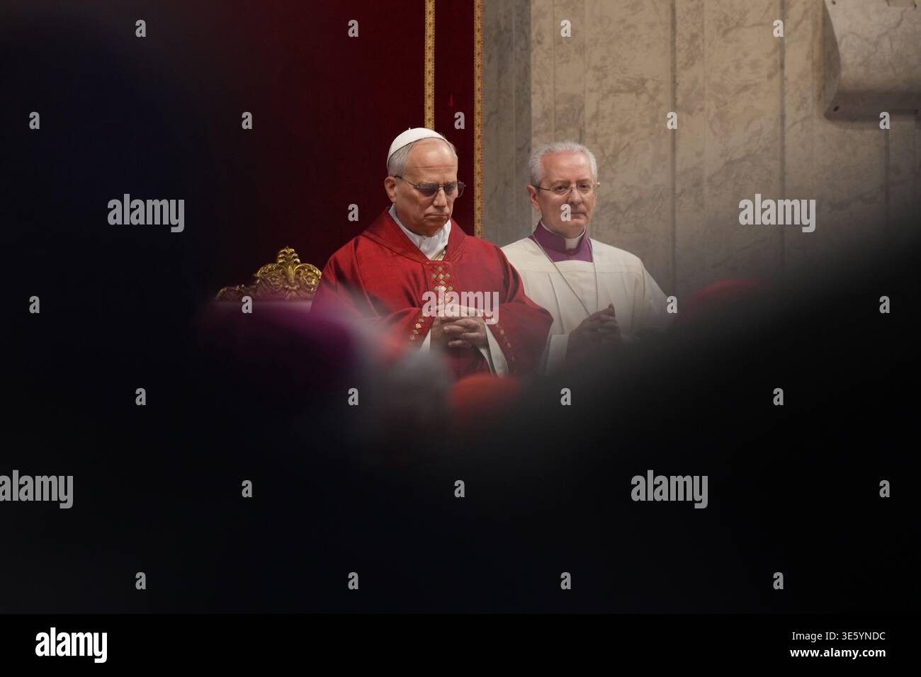 Pope Leo XIV, flanked by Master of Pontifical Liturgical Celebrations, Archbishop Diego Giovanni Ravelli, right, attends the Celebration of the Passion of the Lord in St. Peter's Basilica at the Vatican on Catholic Good Friday, Friday, April 3, 2026 (AP Photo/Andrew Medichini) Banque D'Images