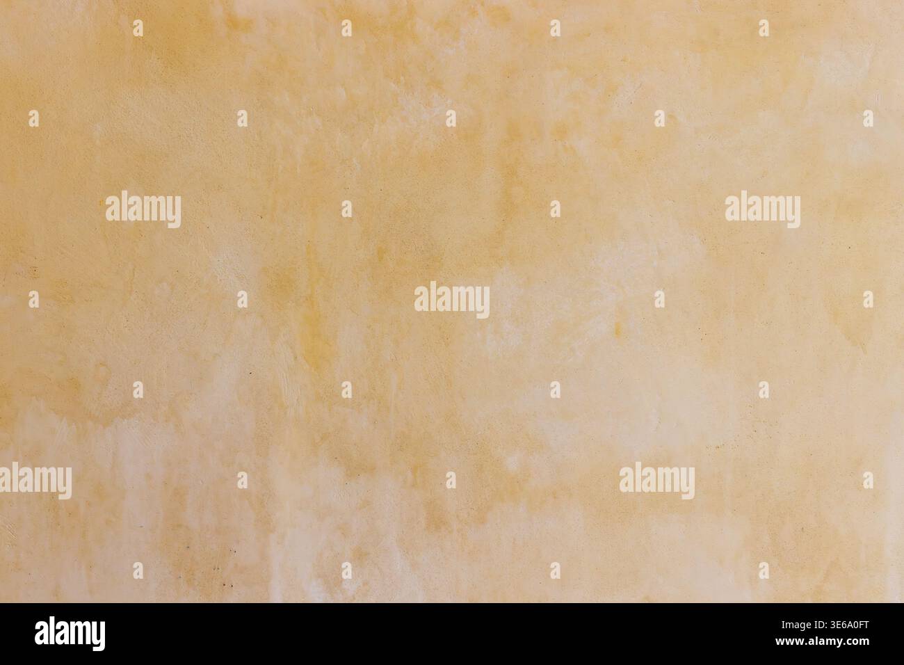 Fond texturé beige chaud avec des teintes dorées douces Banque D'Images