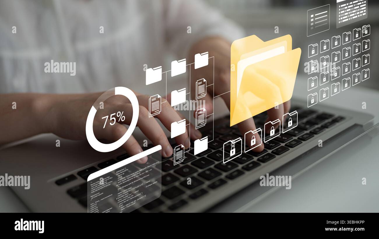 Gros plan des mains tapant sur un clavier entouré d'icônes de fichiers numériques et de visuels de données, illustrant un espace de travail moderne et productif dans un Banque D'Images