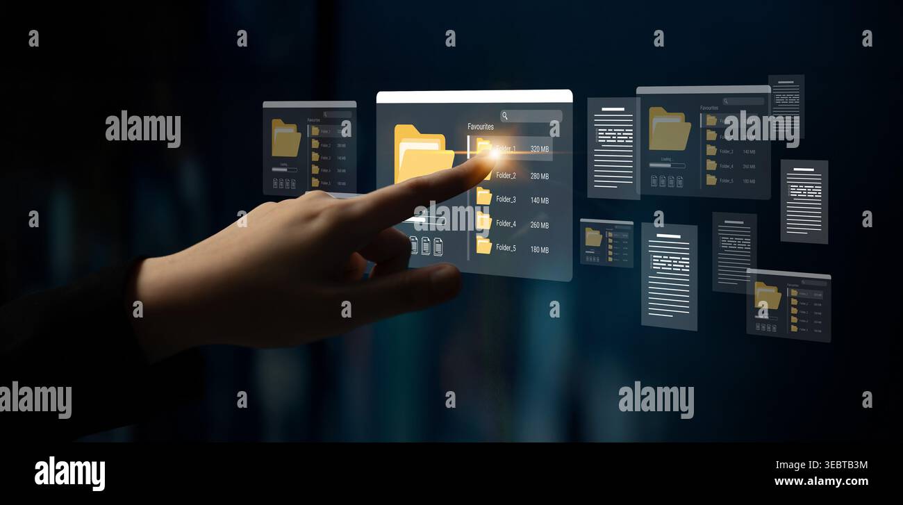 Une personne interagit avec une interface numérique élégante qui affiche des fichiers et des dossiers virtuels, mettant en valeur la technologie de pointe dans la gestion moderne des données Banque D'Images