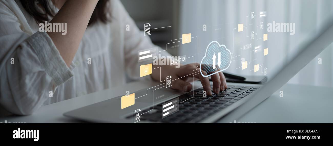 Une femme s’engage avec un ordinateur portable tandis que les graphiques de la technologie cloud illustrent la communication numérique et la gestion des données, mettant en valeur la dynamique de travail moderne Banque D'Images