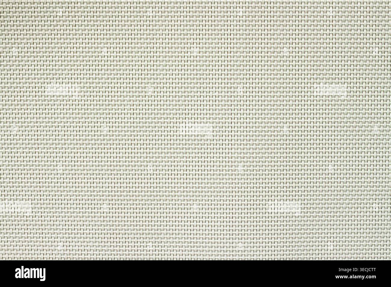 Texture de fond macro horizontale plein cadre de serviette en plastique vert clair et beige motif à carreaux tressé géométrique Banque D'Images