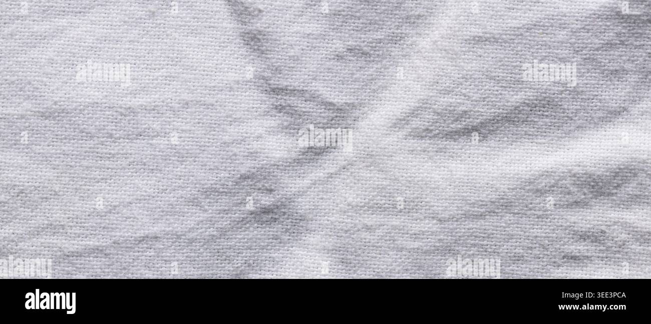 Texture de tissu tricoté blanc avec des taches grises naturelles Banque D'Images