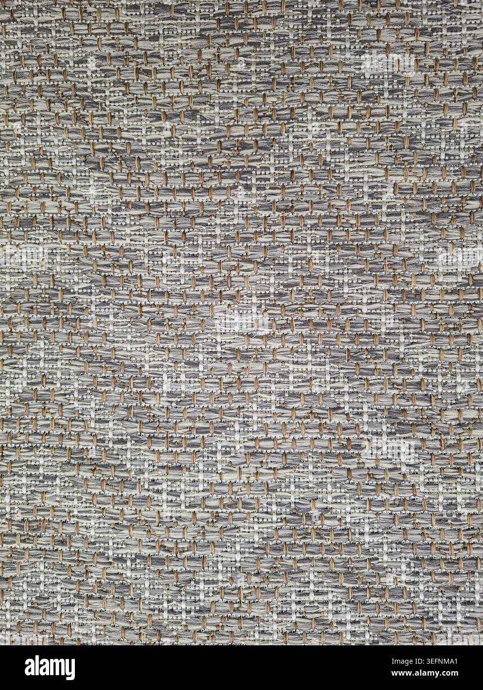 Ce gros plan révèle une texture de tissu tissé gris avec un motif entrelacé répétitif. Il convient à divers projets de conception textile, y compris Banque D'Images
