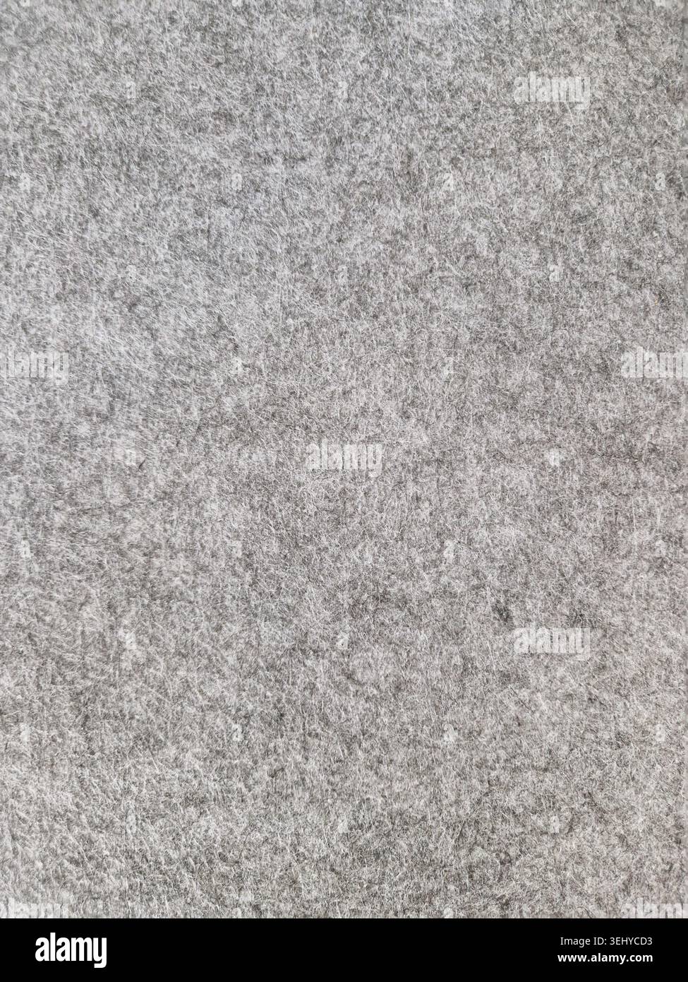 Tissu feutre gris montrant une texture textile douce et lisse, offrant un fond de matériau chaud et isolant pour le design, les projets d'artisanat Banque D'Images