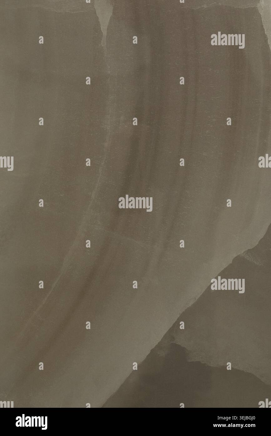 Les nuances tourbillonnantes de beige et de brun se mélangent parfaitement, créant une toile de fond apaisante et sereine parfaite pour l'art ou le design. Les textures lisses i Banque D'Images