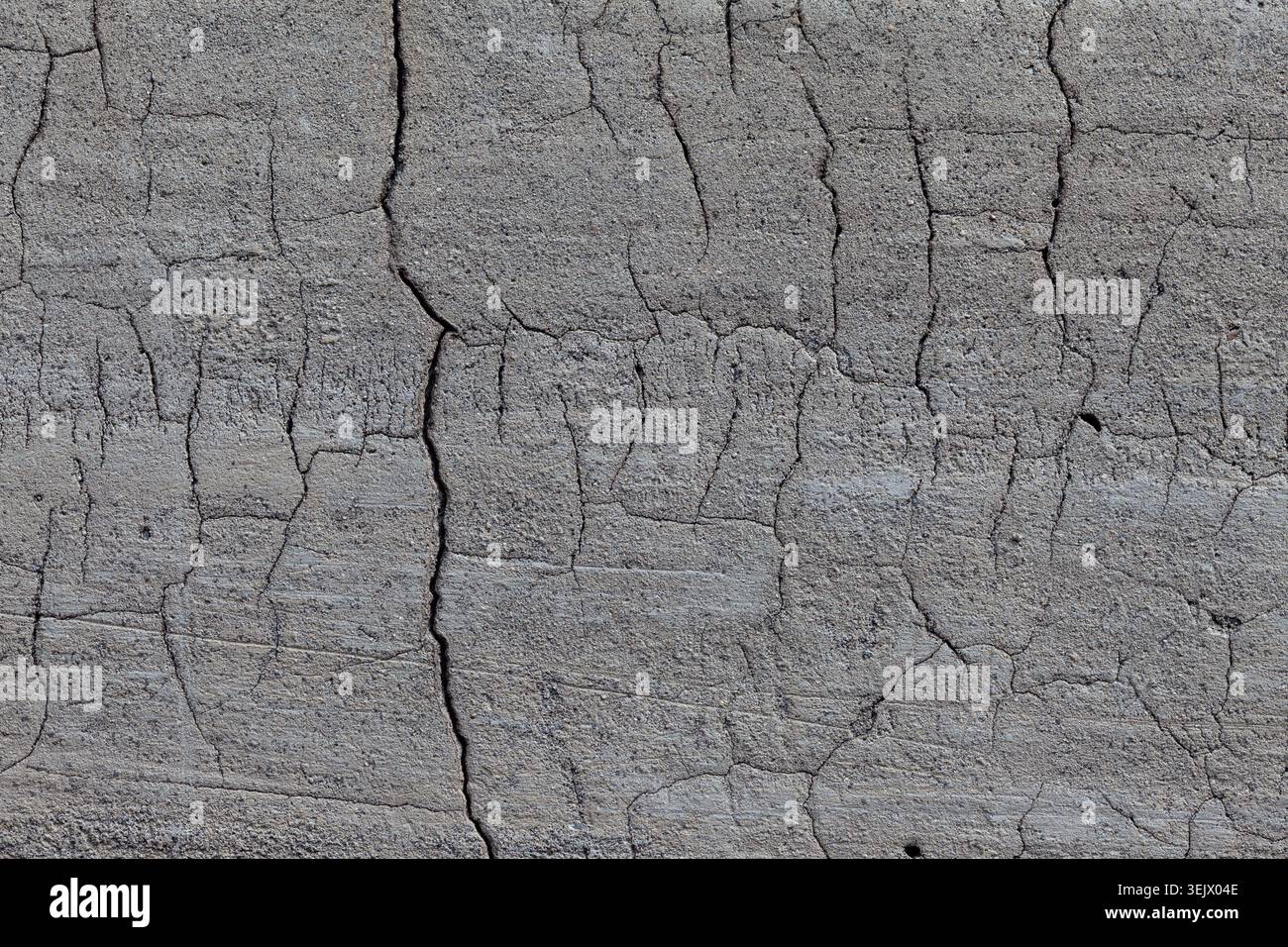 Texture de fond gris plâtre craquelé gros plan Banque D'Images