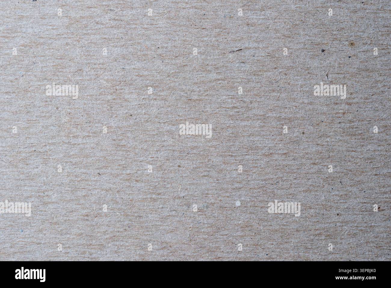Le papier brun doux affiche une texture douce, invitant à la créativité et au calme. Banque D'Images