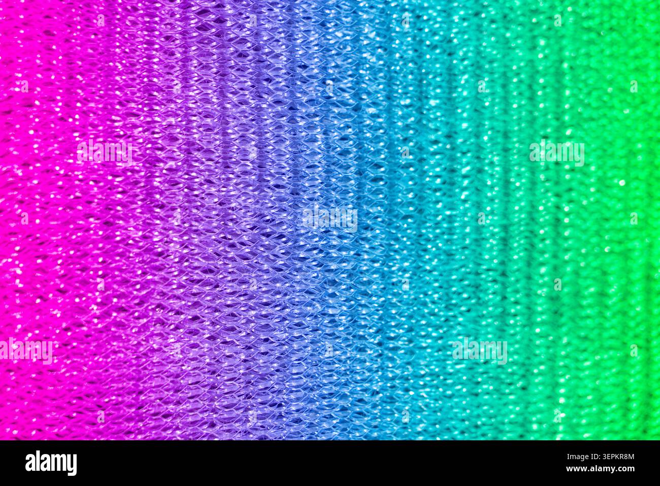 Un fond éclatant et éclatant de texture scintillante avec un arc-en-ciel de couleurs, créant une surface vivante, festive et visuellement attrayante adaptée à c Banque D'Images