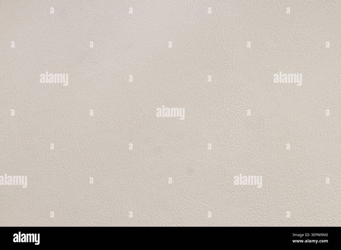 Fond de texture en cuir beige clair avec motif de grain subtil couleur crème neutre et surface de matériau naturel, ce matériau naturel offre un ele Banque D'Images