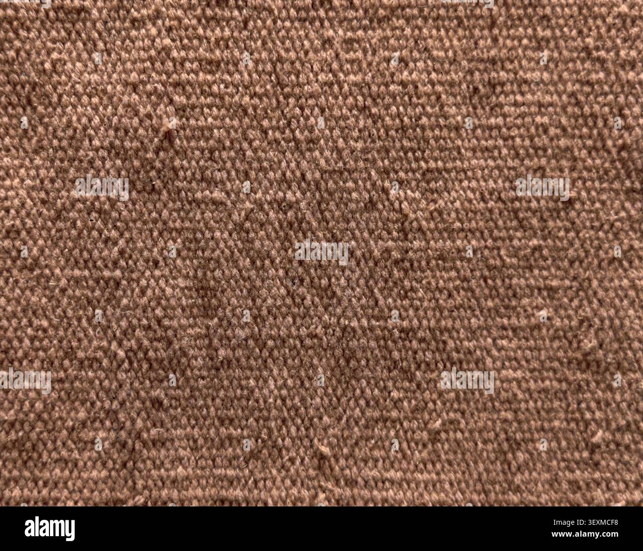 Texture en gros plan du fond de matériau de toile de tissu brun tissé Banque D'Images