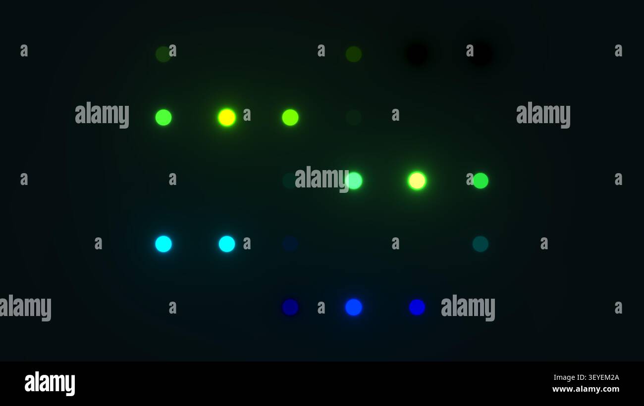 Des points lumineux apparaissent en vert, bleu et jaune sur un fond sombre créant un affichage vibrant et coloré. L'agencement forme un motif aléatoire Tha Banque D'Images