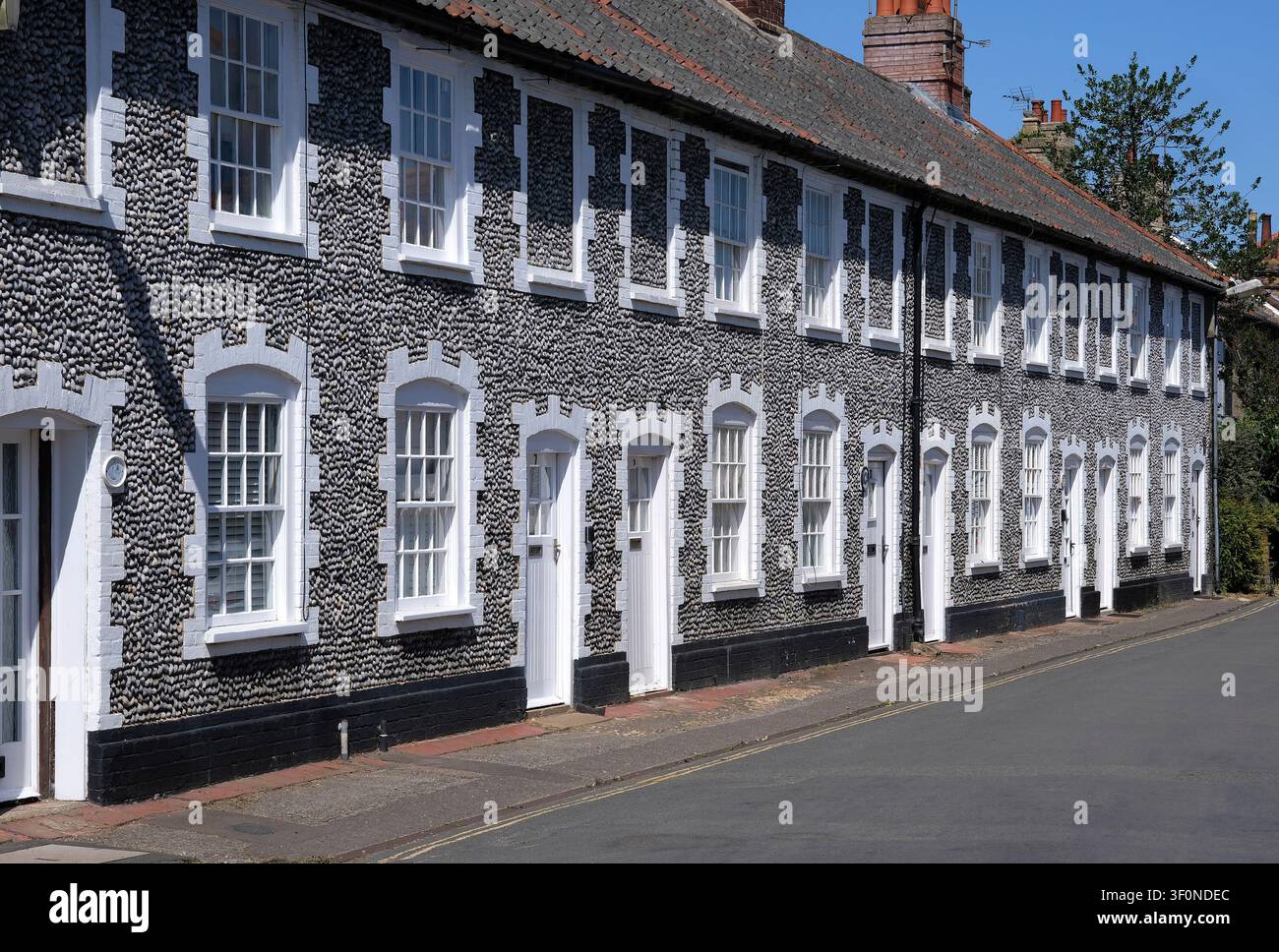 rangée de cottages en pierre de silex, Holt, Nord-Norfolk, Angleterre Banque D'Images