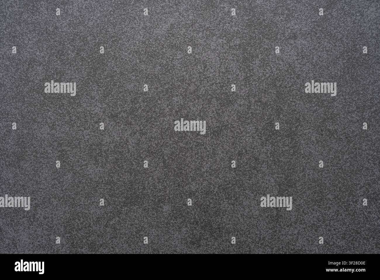 Texture fine d'une feuille de papier abrasif gris foncé mat avec une surface granuleuse abrasive. Banque D'Images