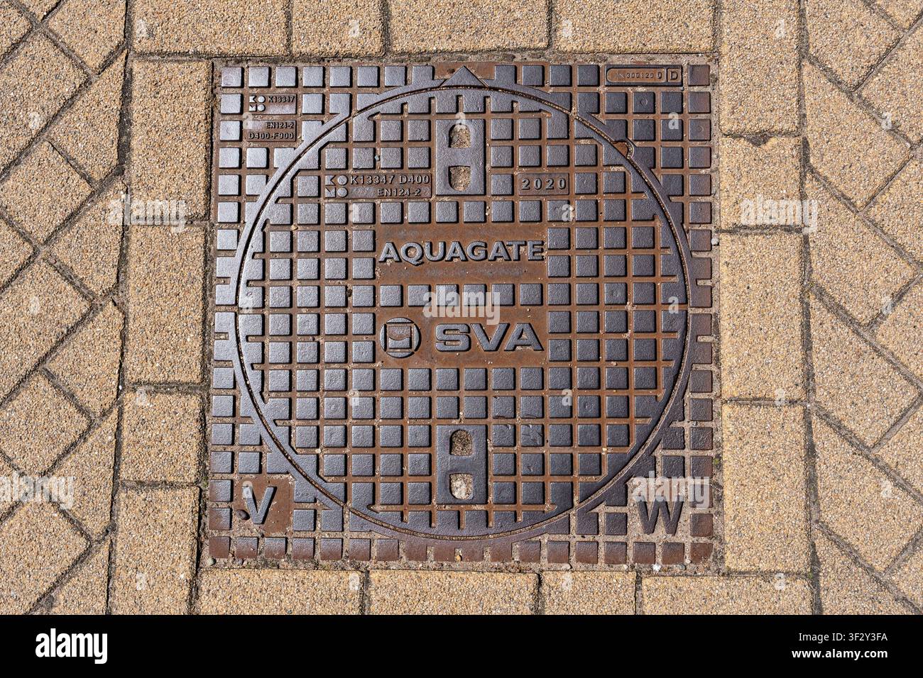 Couverture d'égout en fonte Aquagate Banque D'Images