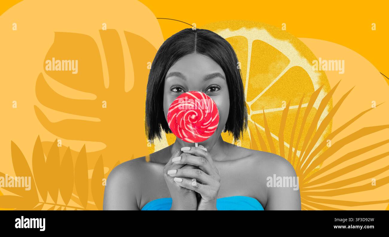 Femme noire heureuse tenant une sucette et souriant devant un fond jaune vif Banque D'Images