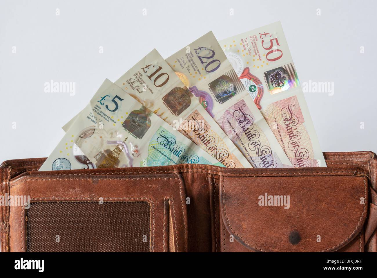 Portefeuille avec des billets en livres sterling Banque D'Images