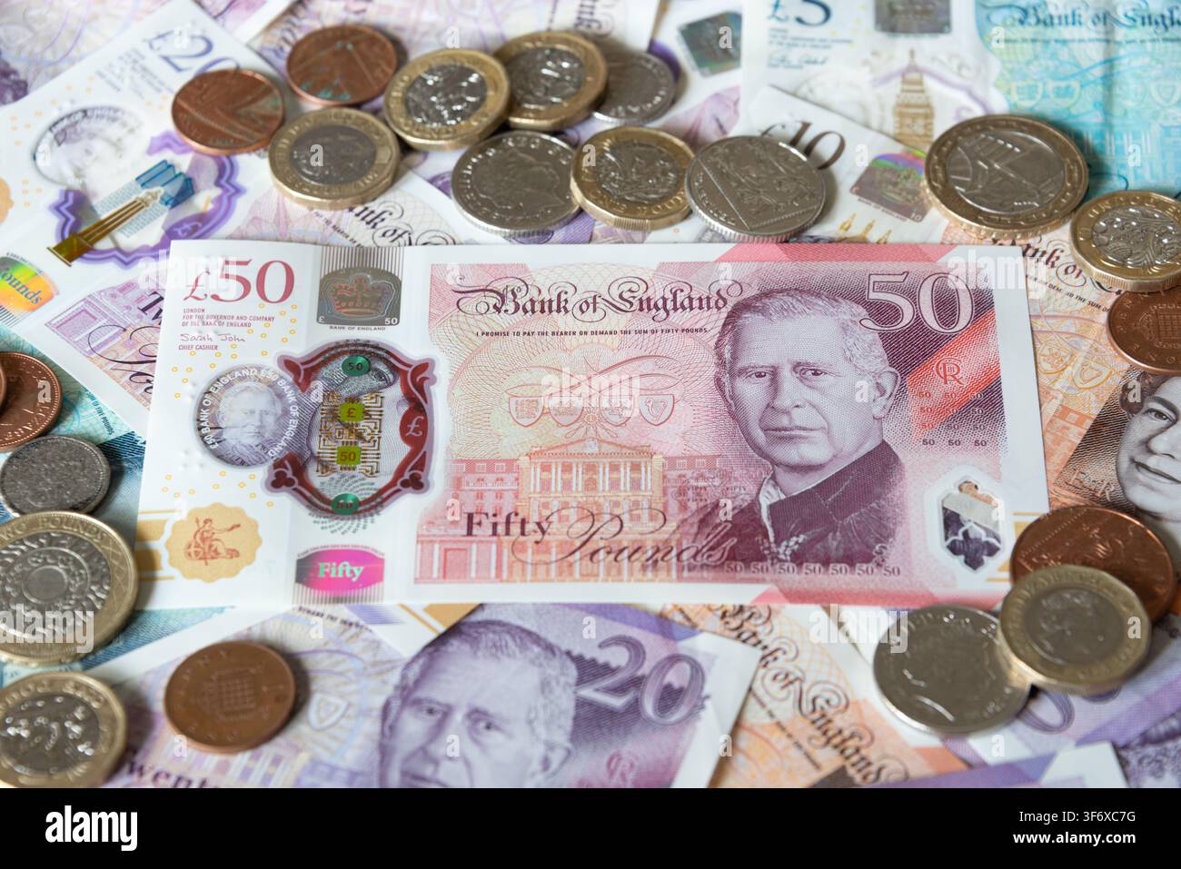Billets et pièces en livres britanniques Banque D'Images