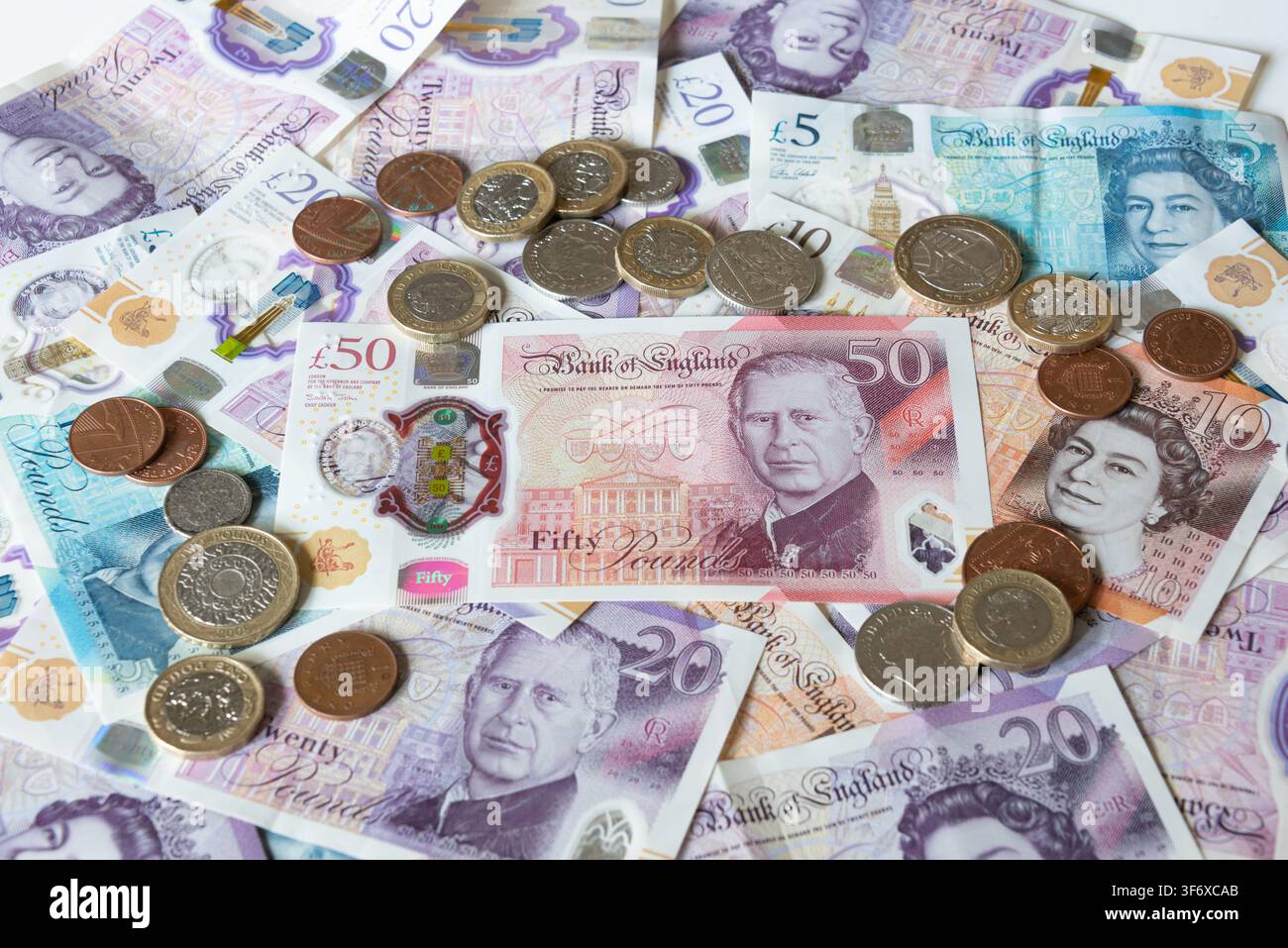 Billets et pièces en livres britanniques Banque D'Images