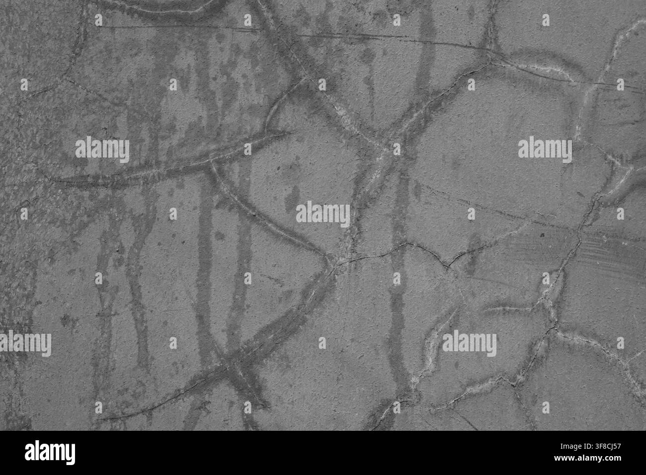 Texture haute résolution de béton gris usé avec des fissures profondes et des taches. Parfait pour les designs industriels, les arrière-plans rugueux et l'architecture urbaine Banque D'Images