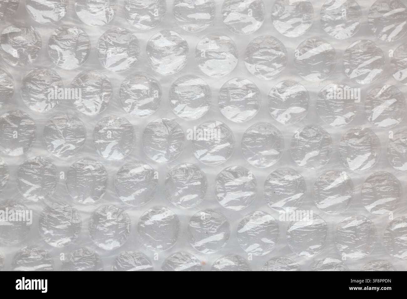 Arrière-plan en texture de film à bulles en plastique pour le concept d'emballage et d'expédition Banque D'Images