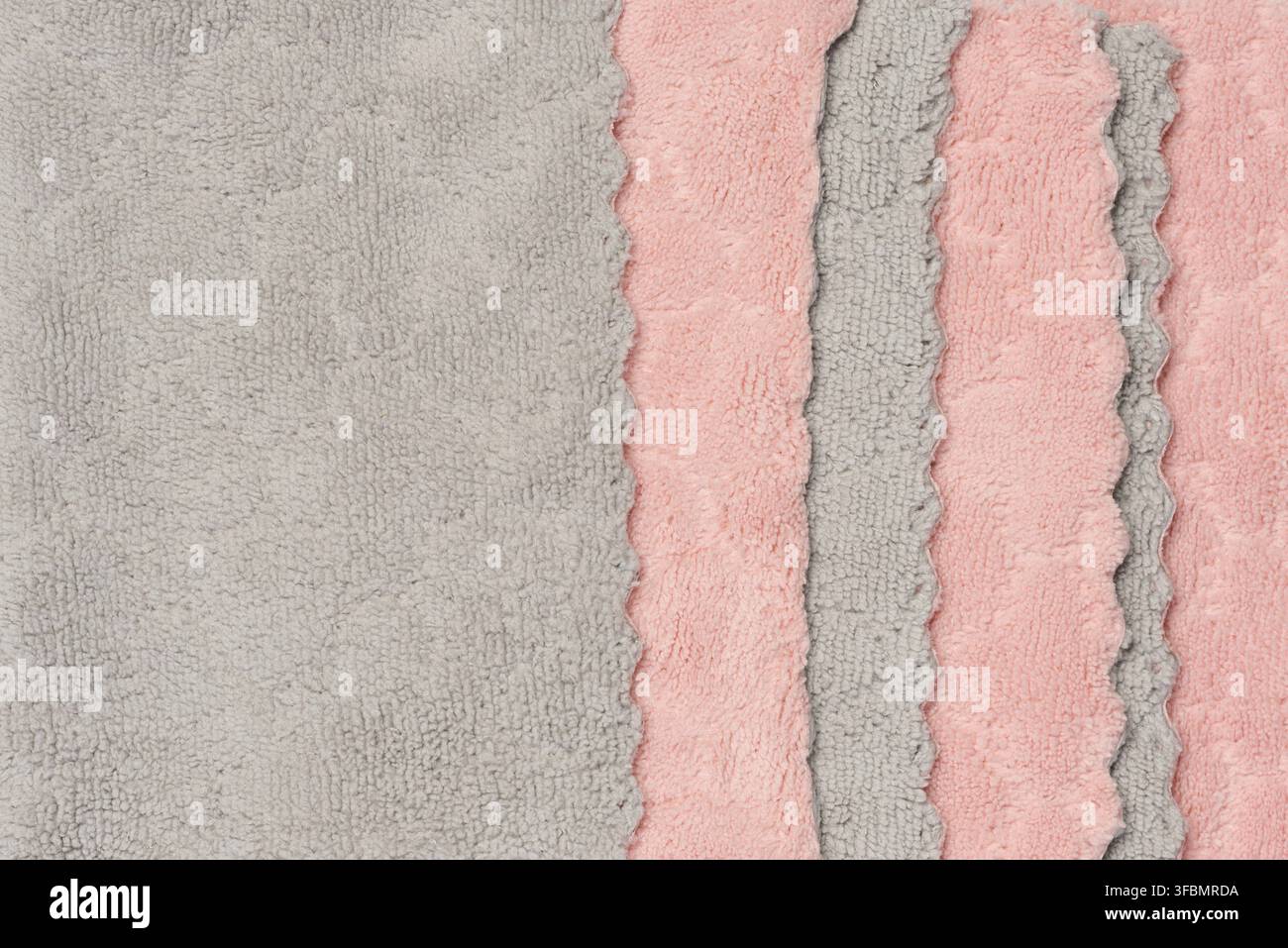 Texture de tissu en peluche gris rose, textile de maison. Gros plan Banque D'Images