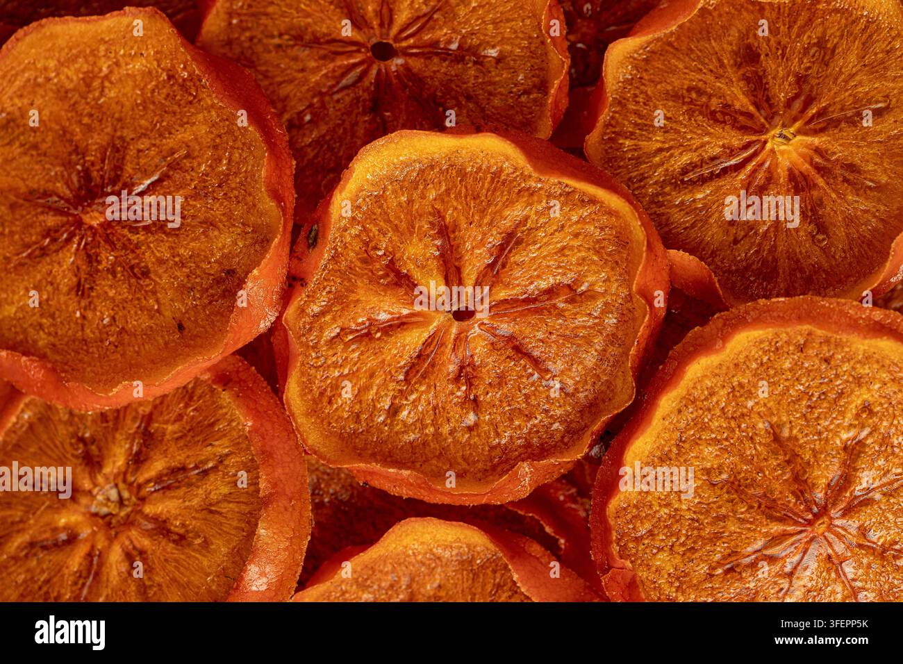 Tranches de fruit de kaki séchées texture gros plan Banque D'Images
