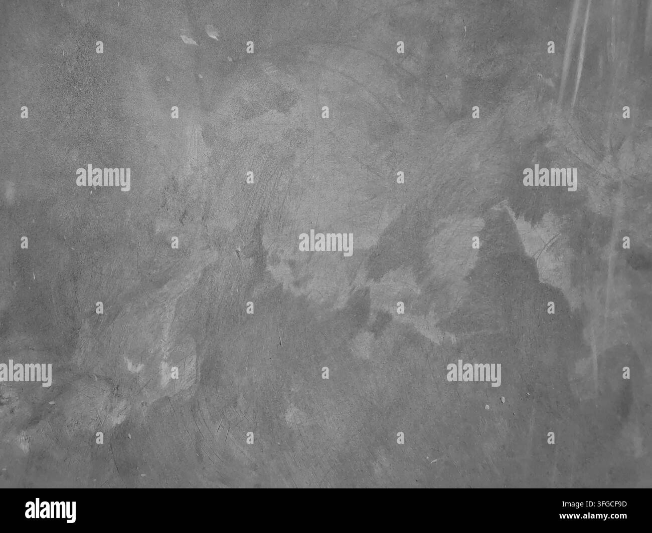 Texture de mur en béton poli gris avec des rayures et des taches naturelles, parfaite pour un design de fond industriel et minimaliste. Banque D'Images