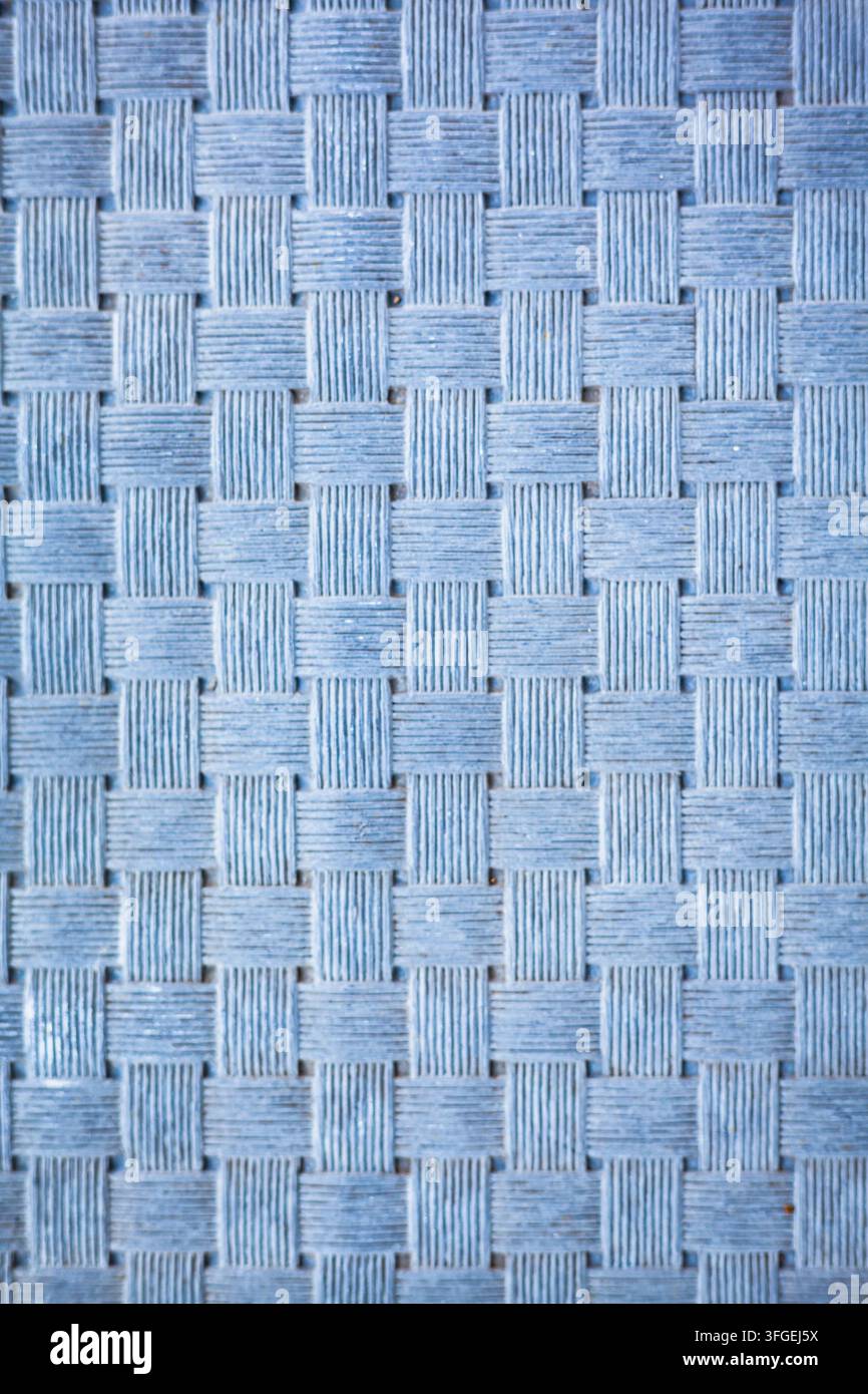 Texture abstraite d'un motif de cordon tissé ou tressé bleu créant un effet géométrique détaillé et répétitif Banque D'Images