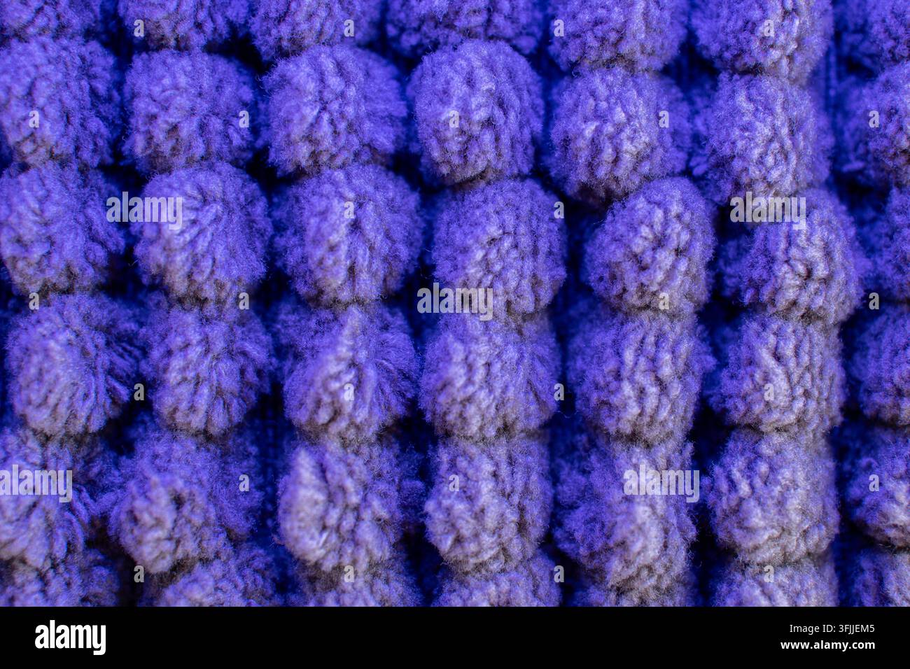 Tissus bleus texturés présentant des motifs tricotés avec des boucles douces Banque D'Images