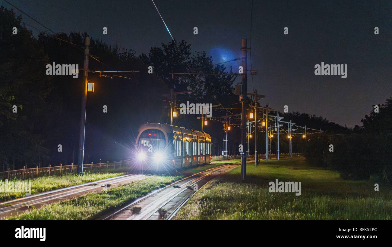 Excursion touristique en tramway de la ligne Xijiao à Pékin la nuit Banque D'Images