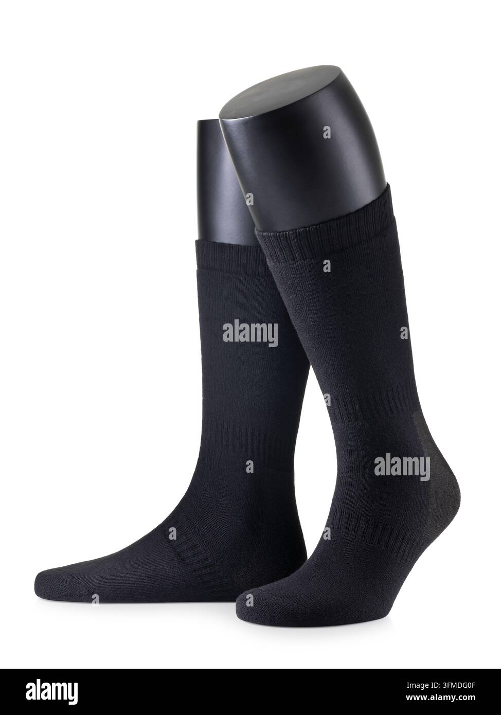 Chaussettes de chasse noires montant jusqu'aux genoux sur des jambes de mannequin isolées sur fond blanc, photographie de produit Banque D'Images