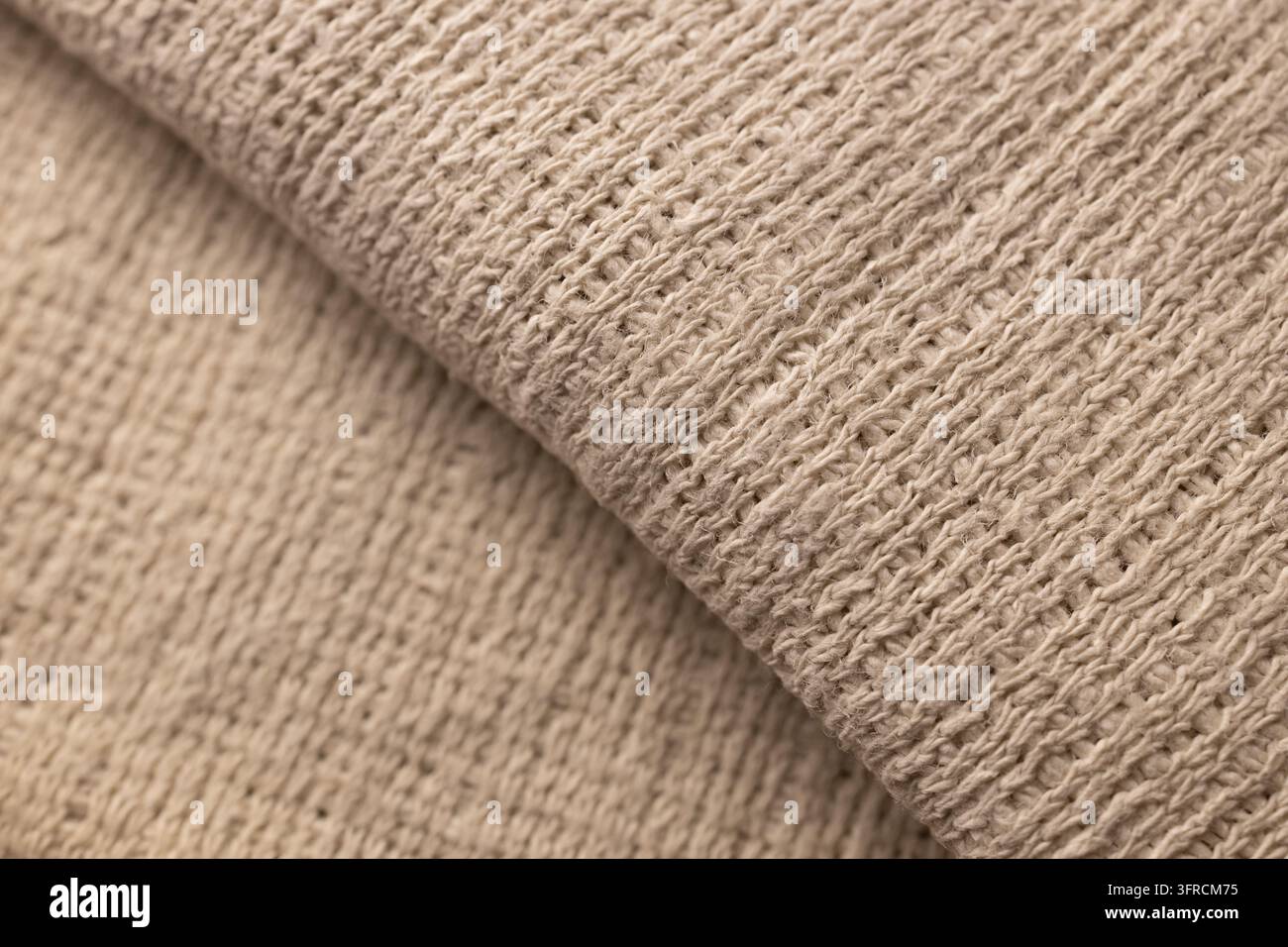 Texture de tissu tricoté beige avec couches superposées, fond textile en gros plan Banque D'Images