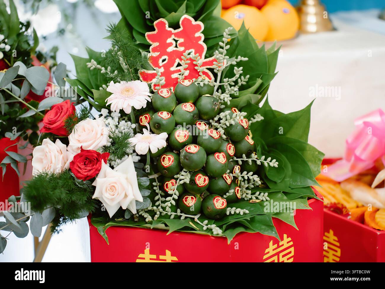 Arrangement cadeau traditionnel chinois de noix d'arec et feuilles de betel pour les fiançailles Banque D'Images