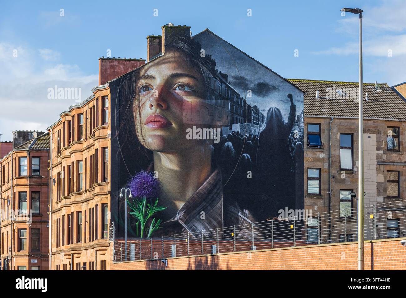 La fresque située au 1198 Govan Road rend hommage à Mary Barbour, une figure de premier plan dans la lutte pour les droits des femmes et la justice sociale. Banque D'Images