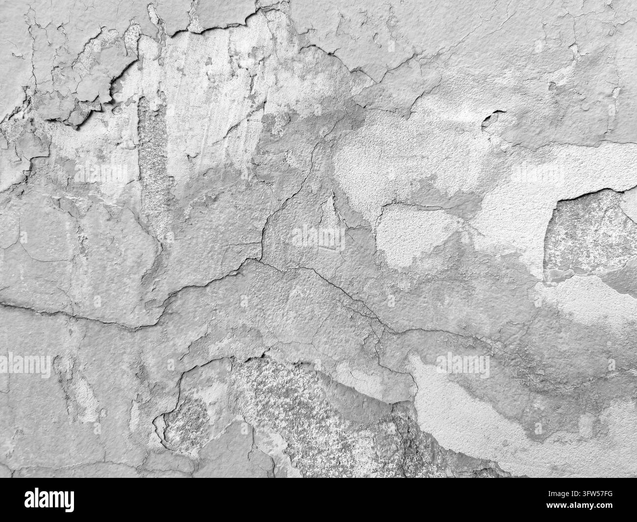 Mur ancien enduit dégradé texturé avec fissures et peinture écaillée. Fond vintage à l'esthétique grunge. Espace de copie. Gros plan. Focus sélectif Banque D'Images