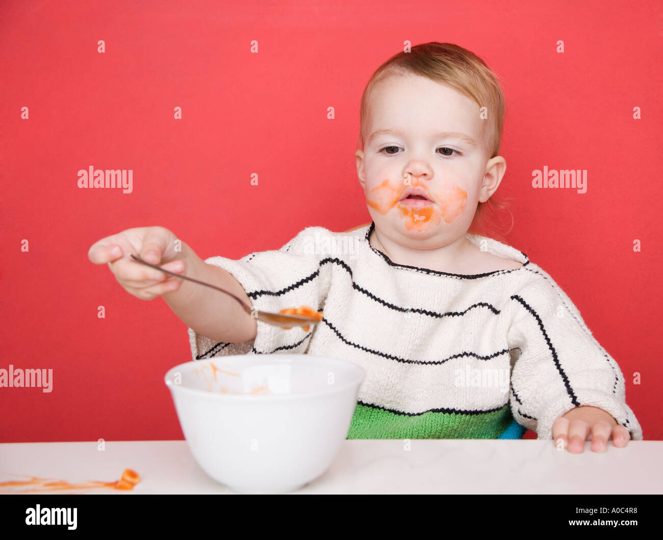 Female toddler eating Banque D'Images