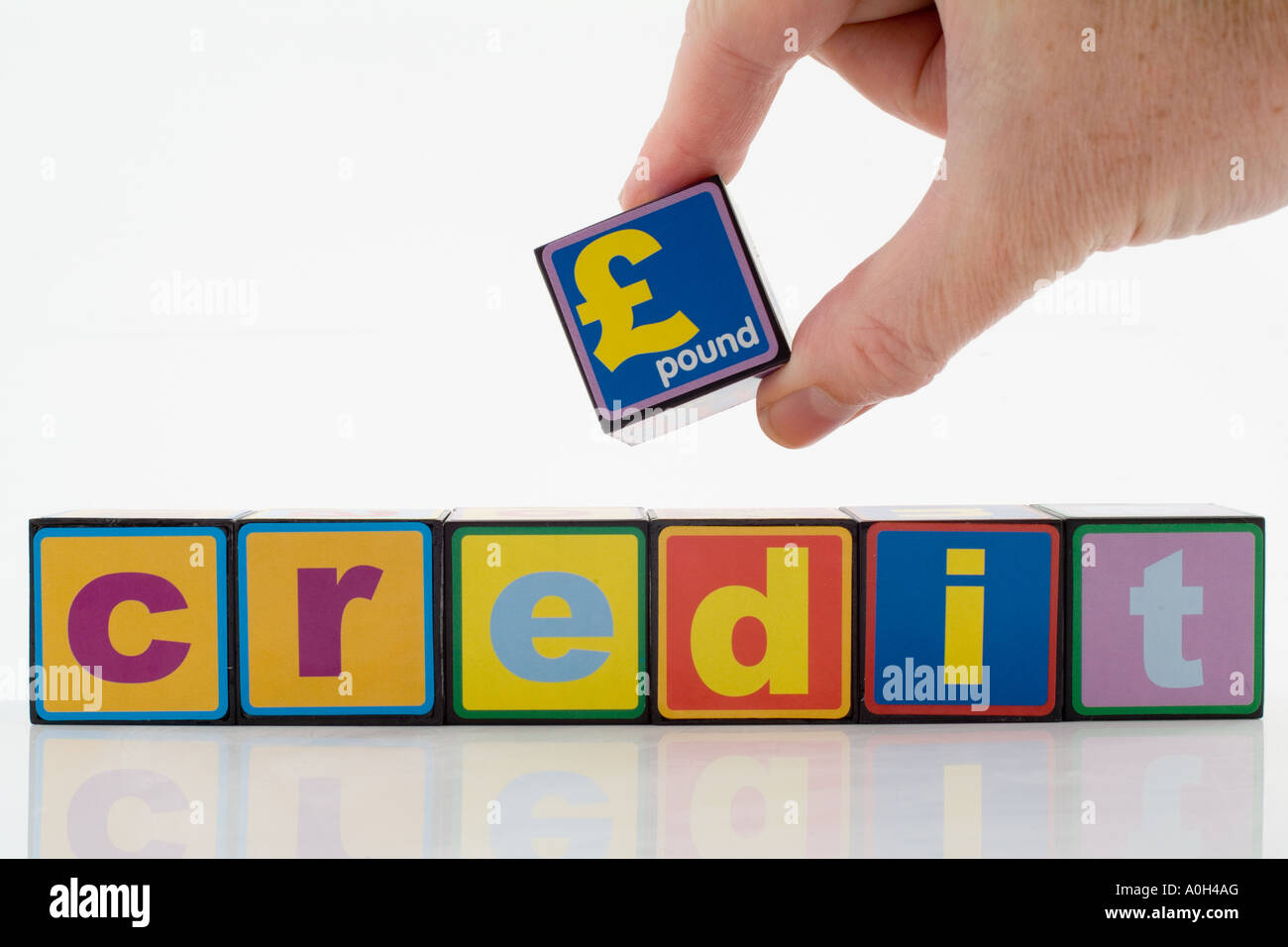 Blocs de construction de jouets avec la parole et le symbole de la livre sterling Banque D'Images