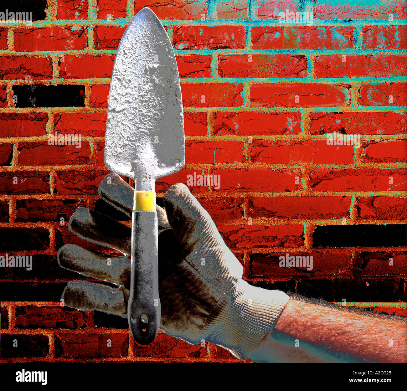 Mur de brique la main couche Gant Banque D'Images