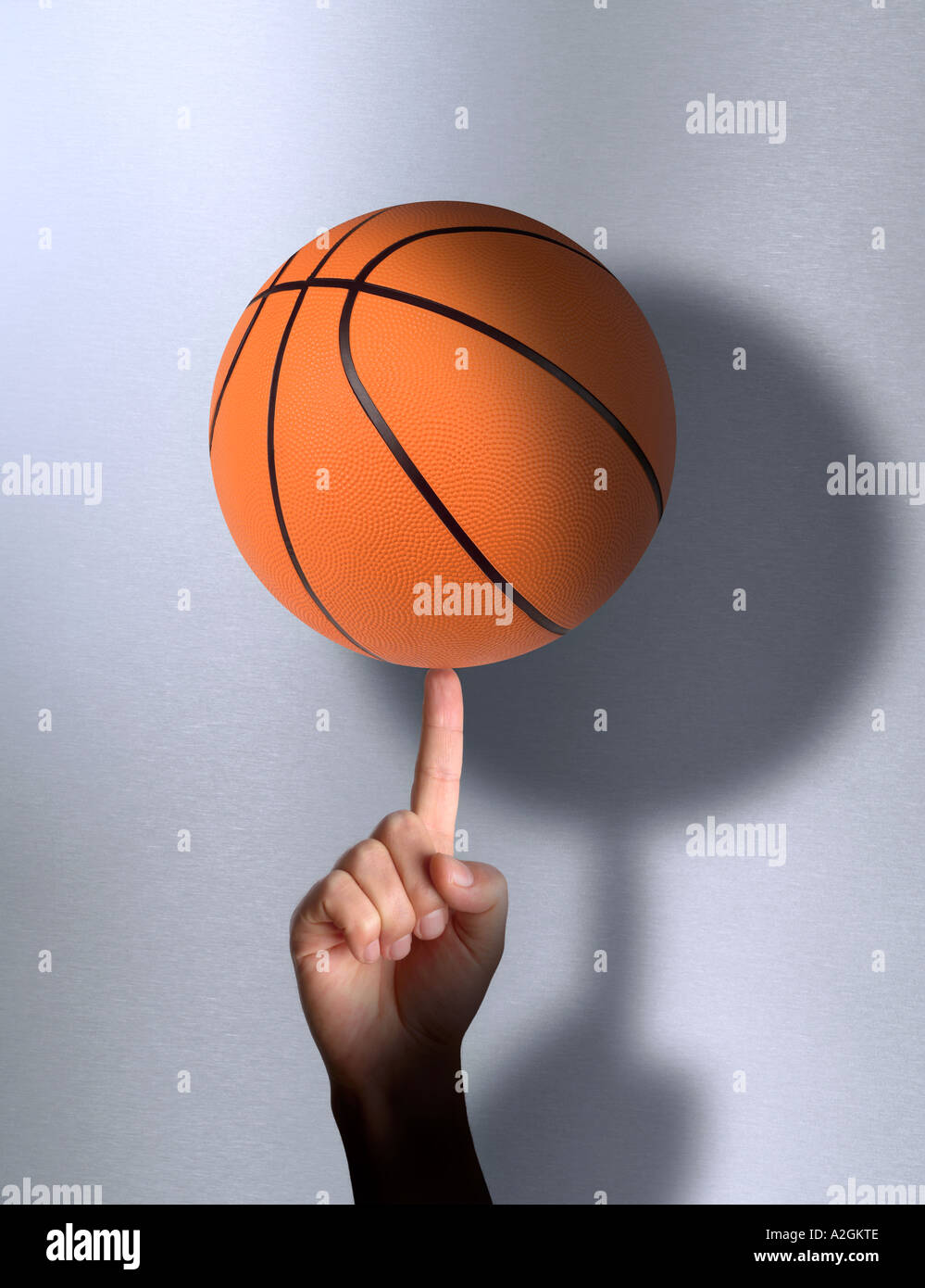 Basket-ball sur le bout du doigt Banque D'Images