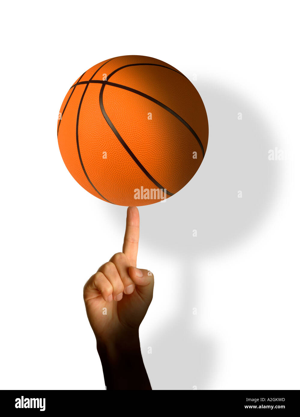 Basket-ball sur le bout du doigt Banque D'Images