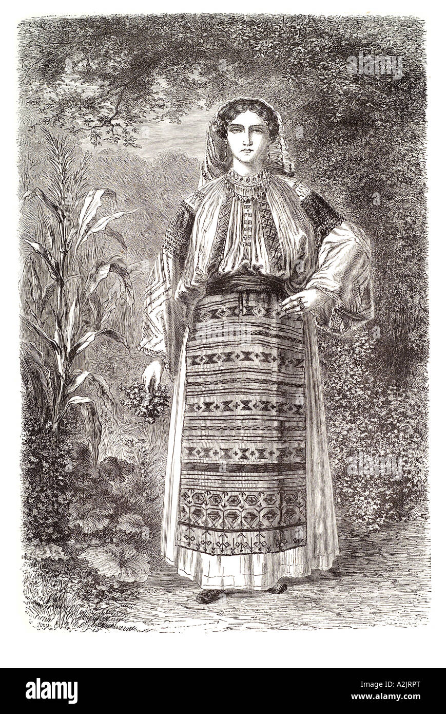 Roumanie Romanian Valaques costume traditionnel local La Valachie femme chemisier jupe chapeau jardin tablier patrimoine folklorique posent la Transylvanie Banque D'Images