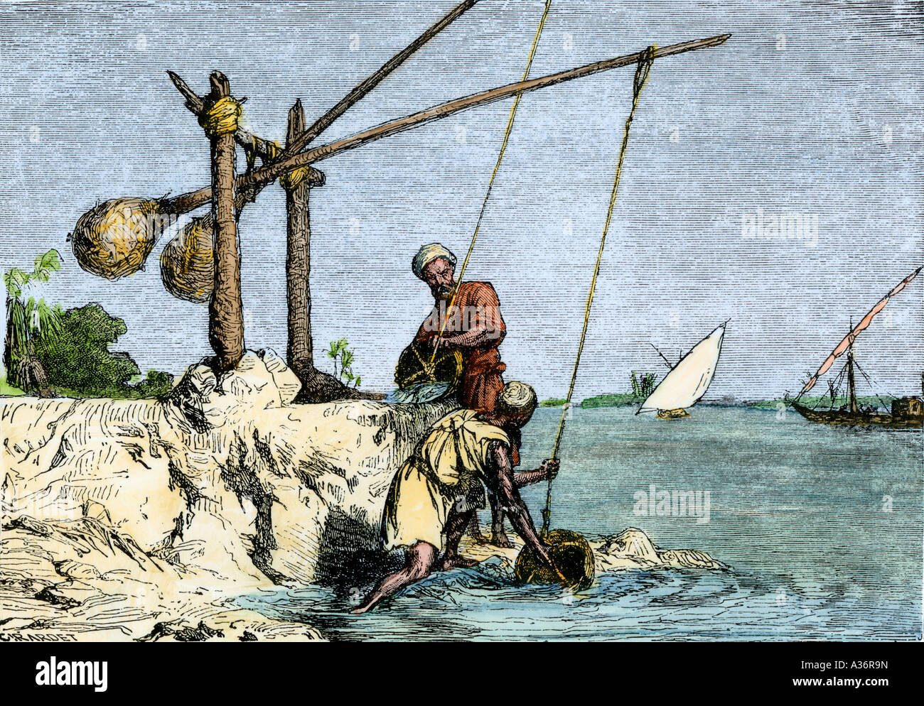 Les Égyptiens le long du Nil, de l'eau avec un shadoof contrebalancé un dispositif utilisé depuis les temps anciens. À la main, gravure sur bois Banque D'Images
