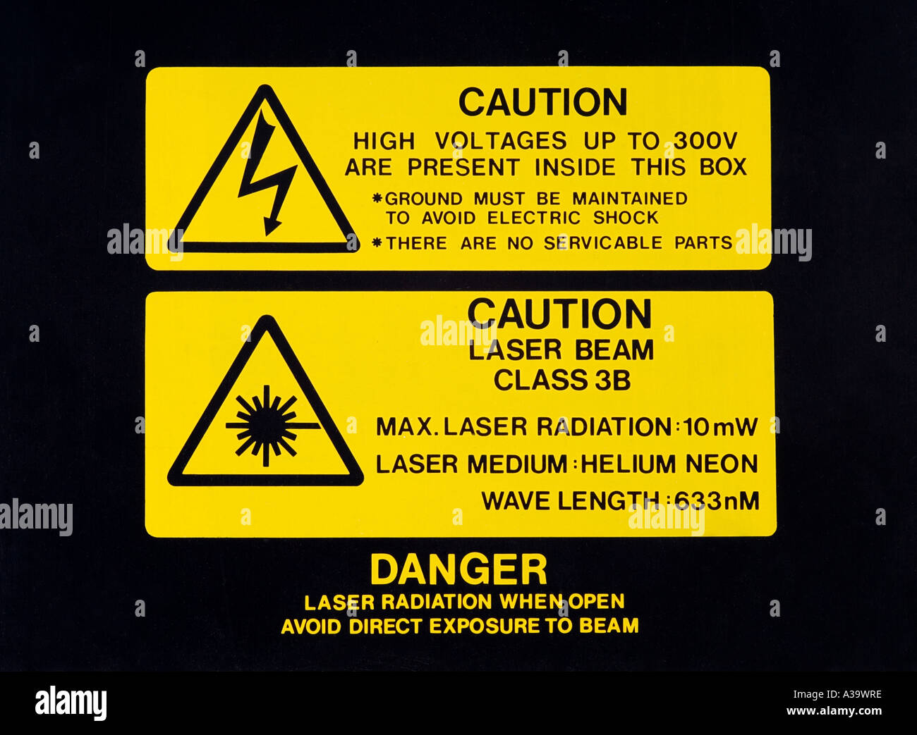 Le rayonnement laser de Classe 3B et des étiquettes d'avertissement de tension élevée Banque D'Images
