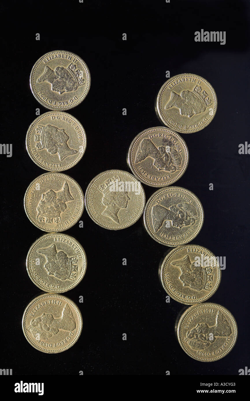 British pound coins font lettre k sur noir Banque D'Images