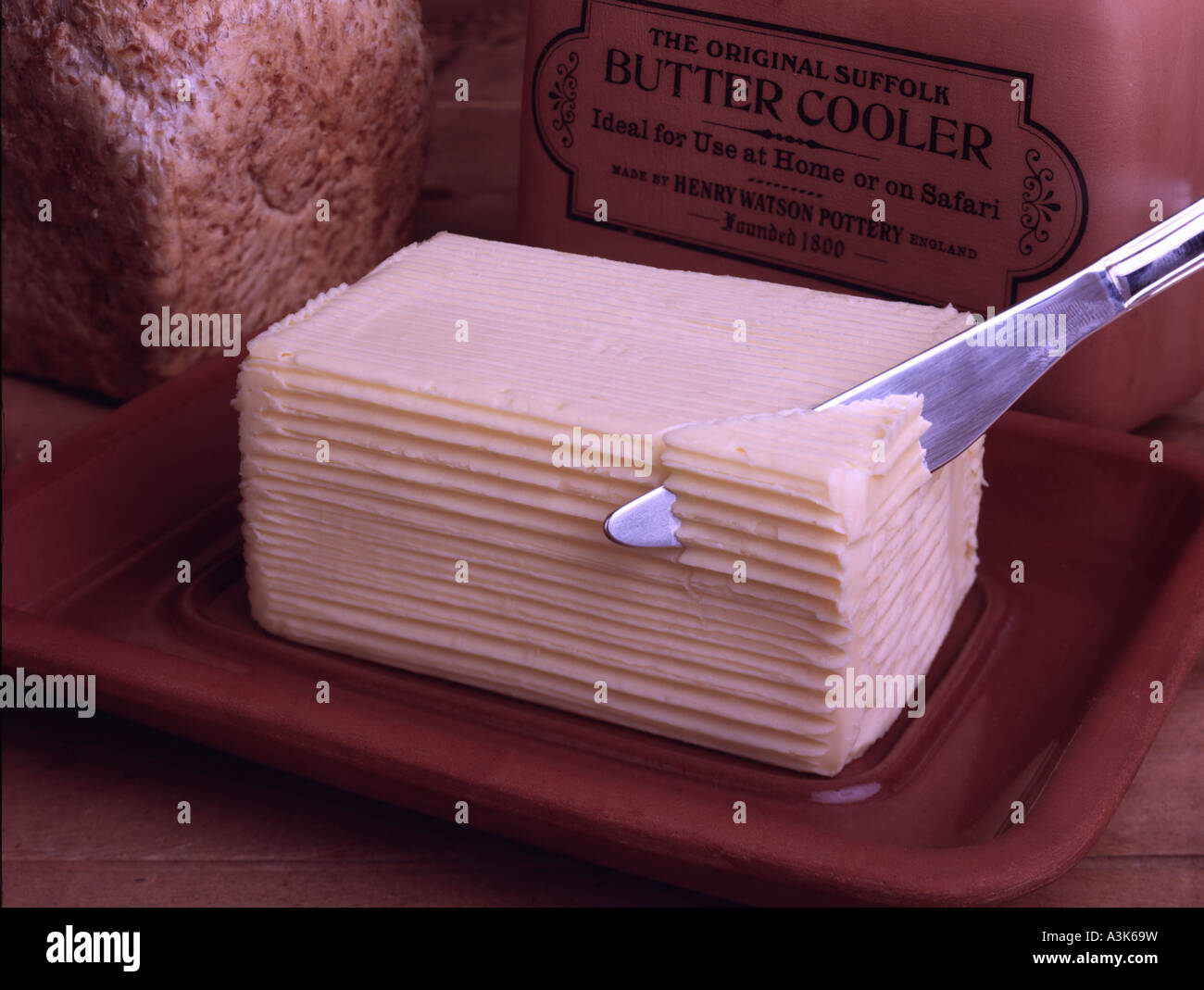 Le beurre et le beurre d'argile glacière Banque D'Images